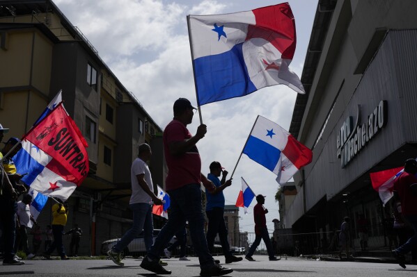 Protesters march against U.S. Secretary of State Marco Rubio's visit in Panama City, Sunday, Feb. 2, 2025. (AP Photo/Matias Delacroix)