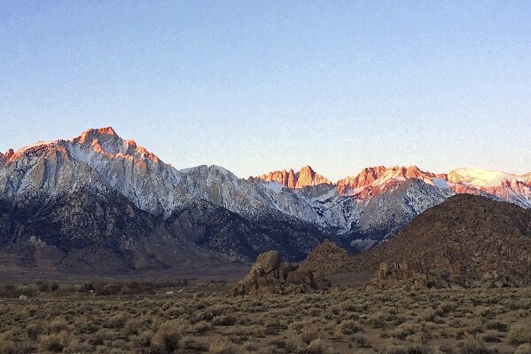 FILE - Seen is the eastern Sierra Nevada, with Mt. Whitney, the largest of three pinnacles at center, near Lone Pine, Calif., on Dec. 21, 2016. A pilot from France who disappeared while hiking California's towering Mount Whitney was found dead after falling about 1,000 feet (305 meters) off a cliff, the National Park Service said Friday, Oct. 20, 2023. The hiker was identified as Tom Gerbier, of Fontenay-sous-Bois, France, who was a pilot for Air France, the park service said in a statement. (AP Photo/Brian Melley, File)