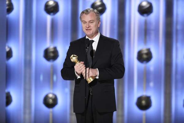 This image released by CBS shows Christopher Nolan accepting the award for best director for "Oppenheimer" during the 81st Annual Golden Globe Awards in Beverly Hills, Calif., on Sunday, Jan. 7, 2024. (Sonja Flemming/CBS via AP)