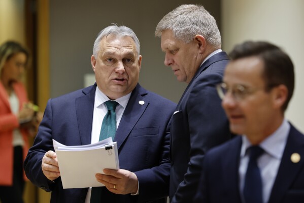 Slovakia's Prime Minister Robert Fico, right, talks to Hungary's Prime Minister Viktor Orban during a round table meeting at an EU summit in Brussels, Thursday, Feb. 1, 2024. Prime Minister Robert Fico returned to power in Slovakia last year. Having previously served twice as prime minister, from 2006 to 2010 and again from 2012 to 2018, the 59-year-old's third term made him the longest-serving head of government in Slovakia’s history. (AP Photo/Geert Vanden Wijngaert, File)