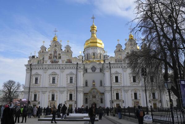 People gather for the Christmas service in the Assumption Cathedral in Lavra, the Monastery of the Caves, Kyiv, Ukraine, Saturday, Jan. 7, 2023. Saturday service was conducted by Ukrainian patriarchate for the first time after Lavra had been under Russia's influence for hundreds of years and was subordinated to Russia. (AP Photo/Efrem Lukatsky)