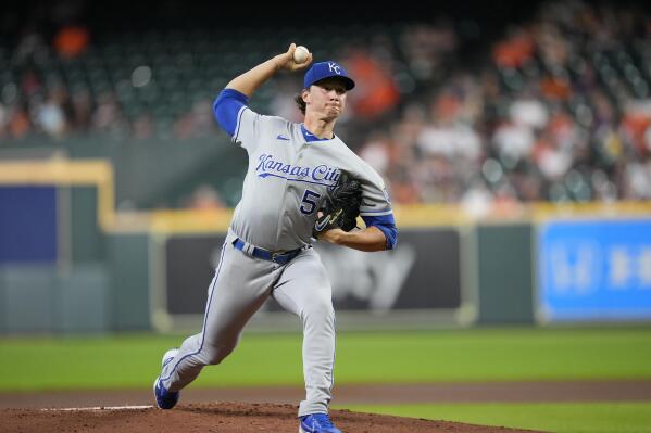 Kansas City Royals starting pitcher Brady Singer throws during the