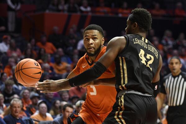 Illinois' Jayden Epps (3) works the ball inside against Lindenwood's Remy Lemovou during the first half of an NCAA college basketball game, Friday, Nov. 25, 2022, in Champaign, Ill. (AP Photo/Michael Allio)