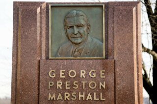 FILE - In this Dec. 14, 2017, file photo, the George Preston Marshall monument outside RFK stadium in Washington is shown. The Washington Redskins are removing former owner George Preston Marshall from their ring of fame and striking all references to him on their website, a spokesman confirmed Wednesday, June 24, 2020. It's the latest move made to cut ties with the legacy of the team's racist founder, who refused to integrate by signing Black players until “forced to do so” in 1962, more than a decade after the rest of the NFL. (AP Photo/Andrew Harnik, File)