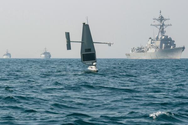 In this photo released by the U.S. Navy, a Saildrone Explorer takes part in a joint U.S. and U.K. naval drill in the Persian Gulf on Friday, Oct. 7, 2022. The U.S. Navy held a joint drone drill with the United Kingdom on Friday in the Persian Gulf, testing the same unmanned surveillance ships called Saildrone Explorers that Iran twice has seized in recent months in the Middle East. (Chief Mass Communication Specialist Roland Franklin/U.S. Navy via AP)