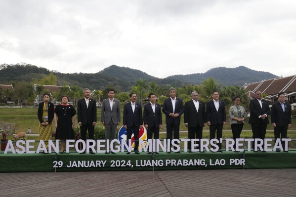 Representatives pose for a group photo during the Association of Southeast Asian Nations (ASEAN) Foreign Ministers retreat meeting in Luang Prabang, Laos, Monday, Jan. 29, 2024. From left, Myanmar's ASEAN Permanent Secretary Marlar Than Htike, Philippine Foreign Undersecretary Theresa Lazaro, Singapore's Foreign Minister Vivian Balakrishnan, Thai Foreign Minister Parnpree Bahiddha-Nukara, Vietnam's Foreign Minister Bui Thanh Son, Laos' Foreign Minister Saleumxay Kommasith, Malaysian Foreign Minister Mohamad Hasan, Brunei's Second Foreign Minister Erywan Yusof, Cambodia's Foreign Minister Sok Chenda Sophea, Indonesian Foreign Minister Retno Marsudi, East Timor's Foreign Minister Bendito dos Santos Freitas and ASEAN Secretary-General Kao Kim Hourn. (AP Photo/Sakchai Lalit)