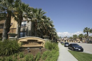 Federal agents raided about 20 locations, related to a birth tourism scheme, in three Southern California counties, including this apartment complex in Rancho Cucamonga, Calif., Tuesday, March 3, 2015. (Stan Lim/The Press-Enterprise via AP,File)