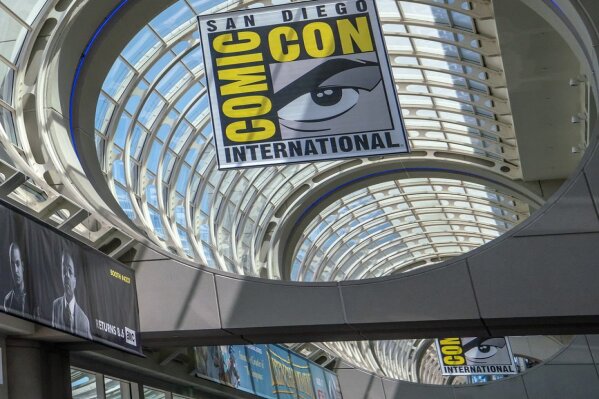 FILE - This July 20, 2018 file photo shows signage for Comic-Con International in San Diego. This year’s San Diego Comic-Con has been canceled due to coronavirus-related restrictions around large gatherings. Organizers say they are planning for the festival to return in July 2021. (Photo by Christy Radecic/Invision/AP, File)