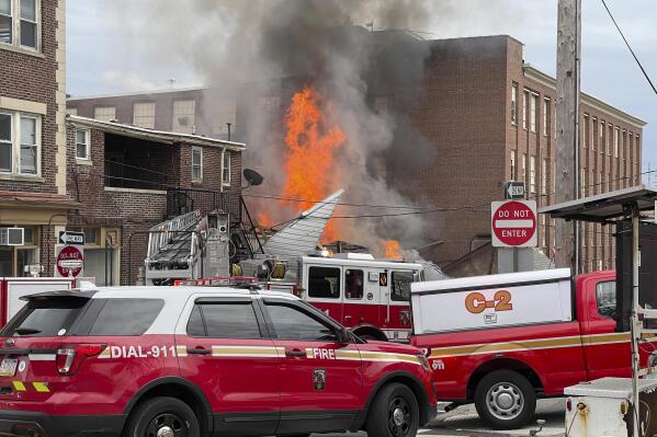 FILE - Emergency personnel work at the site of a deadly explosion at a chocolate factory in West Reading, Pa., March 25, 2023. According to a lawsuit filed Tuesday, April 11, a Pennsylvania candy-maker ignored warnings of a gas leak at its chocolate factory and bears responsibility for a subsequent explosion that killed seven workers. (Ben Hasty/Reading Eagle via AP, File)