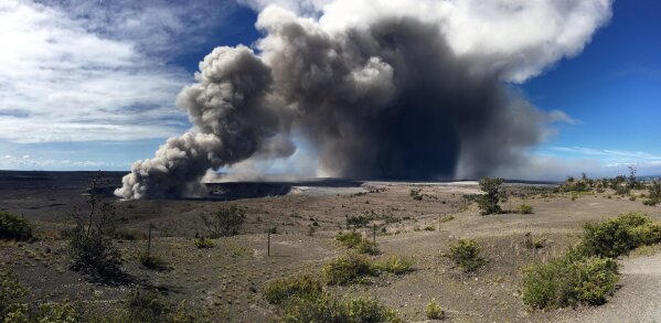 
              This photo from the U.S. Geological Survey shows activity at Halema'uma'u Crater that has increased to include the nearly continuous emission of ash with intermittent stronger pulses at Hawaii Volcanoes National Park on the island of Hawaii at around 9 a.m. Tuesday, May 15, 2018. Plumes range from 1 to 2 kilometers (3,000 to 6,000 feet) above the ground. Officials on the Big Island of Hawaii say some vents formed by Kilauea volcano are releasing such high levels of sulfur dioxide that the gas poses an immediate danger to anyone nearby. (U.S. Geological Survey via AP)
            