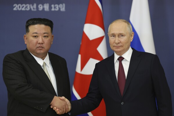 FILE - Russian President Vladimir Putin, right, and North Korea's leader Kim Jong Un shake hands during their meeting at the Vostochny cosmodrome outside the city of Tsiolkovsky, about 200 kilometers (125 miles) from the city of Blagoveshchensk in the far eastern Amur region, Russia, on Sept. 13, 2023. North Korean state media says Russian President Vladimir Putin will arrive in the country on Tuesday for a two-day visit, his first trip to the country in 24 years. (Vladimir Smirnov, Sputnik, Kremlin Pool Photo via AP, File)