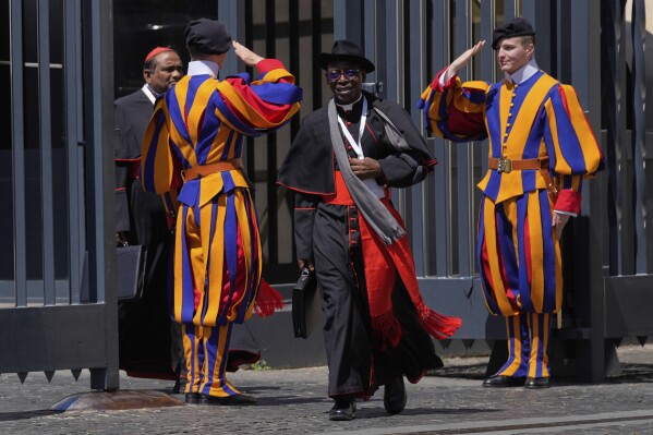Cardinal Ignace Bessi Dogbo, of Ivory Coast, leaves at the end of a college of cardinals' meeting, at the Vatican, Tuesday, April 29, 2025. (AP Photo/Gregorio Borgia)