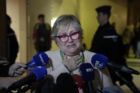 Injured victim, Nadege Renda reacts at the end of the Nice attacks trial at the temporary Courtroom, in Paris, Tuesday, Dec. 13, 2022. A French court has given its verdict Tuesday in a trial over a truck attack more than six years ago by an Islamic State sympathizer that killed 86 people in the French Riviera city of Nice, handing all the eight people charged in connection with the atrocity prison terms ranging from two to 18 years. (AP Photo/Francois Mori)