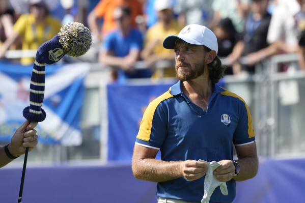 Europe's Tommy Fleetwood walks off the 1st tee during his singles match at the Ryder Cup golf tournament at the Marco Simone Golf Club in Guidonia Montecelio, Italy, Sunday, Oct. 1, 2023. (AP Photo/Alessandra Tarantino)