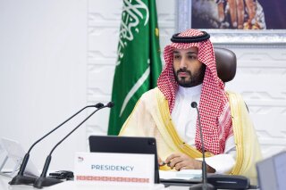 FILE - In this Sunday, Nov. 22, 2020, file photo, Saudi Arabia's Crown Prince Mohammed bin Salman attends a virtual G-20 summit held over video conferencing, in Riyadh, Saudi Arabia. Saudi Arabia's royal court says Crown Prince Mohammed bin Salman underwent a “successful surgery” for appendicitis on Wednesday, Feb. 24, 2021, and left the hospital soon after the operation. The 35-year-old Prince Mohammed had laparoscopic surgery at the King Faisal Specialist Hospital in the Saudi capital of Riyadh in the morning. (Bandar Aljaloud/Saudi Royal Palace via AP, File)