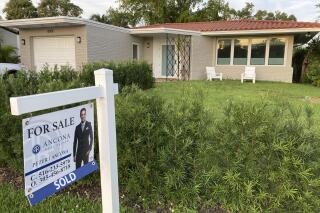 FILE - A home with a "Sold" sign is shown, Sunday, May 2, 2021, in Surfside, Fla.  Average long-term U.S. mortgage rates inched up this week following last week’s mammoth jump, the biggest in 35 years. Mortgage buyer Freddie Mac reported Thursday, June 23, 2022,  that the 30-year rate ticked up to 5.81% this week, from last week’s 5.78%.  (AP Photo/Wilfredo Lee, File)