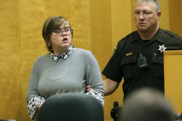FILE - Morgan Geyser enters a Waukesha County courtroom for a status hearing, Sept. 29, 2017, in Waukesha, Wis. Geyser, one of two Wisconsin women accused of stabbing a classmate nearly to death almost a decade ago to please horror character Slender Man, again asked a judge on Tuesday, Jan. 16, 2024, to release her from a mental institution. The judge has set a scheduling conference on the request for Monday, Jan. 29. (Michael Sears/Milwaukee Journal-Sentinel via AP, Pool, File)