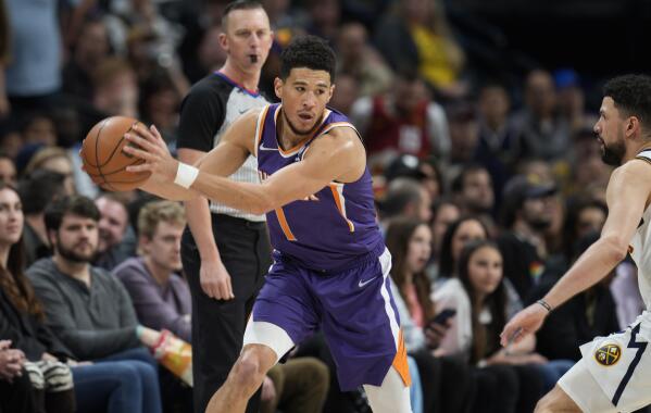 Devin Booker, Chris Paul combine for 60 as Suns hold off short