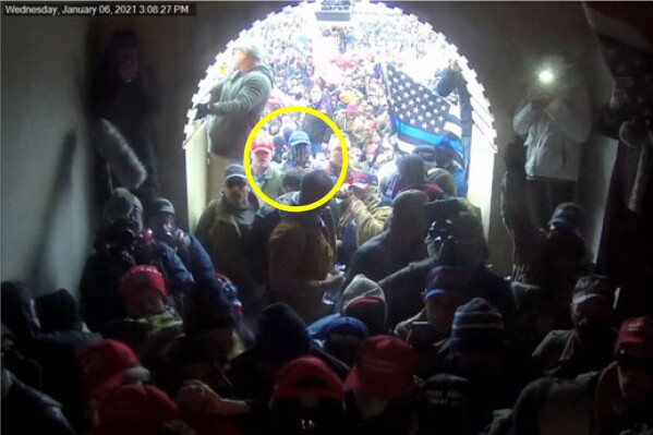 FILE - This image of Larry Giberson, circled in annotation by the Justice Department in the statement of facts supporting the arrest Giberson, shows him outside the U.S. Capitol on Jan 6. 2021. Giberson has been sentenced to two months of incarceration for interfering with police officers trying to hold off a mob of Donald Trump supporters.(Department of Justice via AP, File)