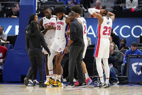 Detroit Pistons forward Marvin Bagley III (35) is helped off the court during the first half of an NBA preseason basketball game against the Oklahoma City Thunder, Tuesday, Oct. 11, 2022, in Detroit. (AP Photo/Carlos Osorio)