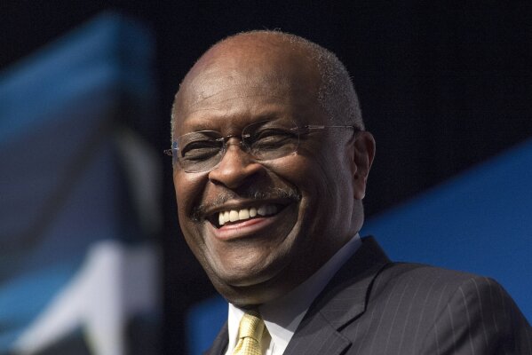 FILE - In this June 20, 2014, file photo, Herman Cain, CEO, The New Voice, speaks during Faith and Freedom Coalition's Road to Majority event in Washington.  Cain has died after battling the coronavirus. A post on Cain's Twitter account on Thursday, July 30, 2020 announced the death.  (AP Photo/Molly Riley, File)