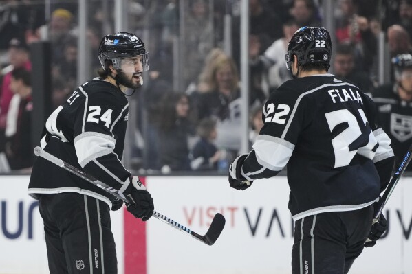 Los Angeles Kings center Phillip Danault, left, celebrates his goal with left wing Kevin Fiala during the first period of an NHL hockey game against the New Jersey Devils, Sunday, March 3, 2024, in Los Angeles. (AP Photo/Ryan Sun)