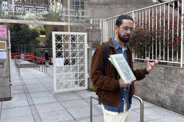 Asad Dandia leads a New York Narratives walking-tour, Saturday, April 19, 2025, in New York. (Fiona André/Religion News Service via AP)
