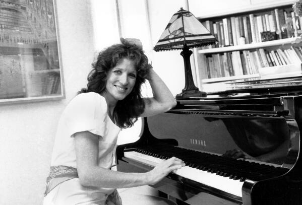 FILE - Lucy Simon sits at the piano in her New York apartment on May 28, 1982. Lucy Simon, the composer who received a Tony nomination in 1991 for her work on the long-running Broadway musical “The Secret Garden,” died Thursday at her home in Piedmont, N.Y., after a long battle with breast cancer. She was 82. (AP Photo, File)