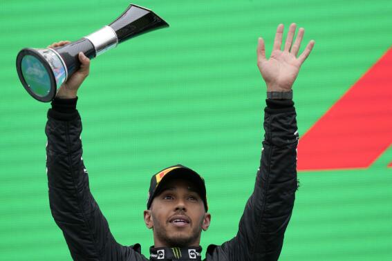 Second placed Mercedes driver Lewis Hamilton of Britain celebrates on the podium after the Hungarian Formula One Grand Prix at the Hungaroring racetrack in Mogyorod, near Budapest, Hungary, Sunday, July 31, 2022. (AP Photo/Darko Bandic)
