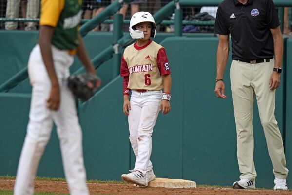 Santa Clara, Utah's Brogan Oliverson (6) stands on first base as a pinch runner during the fifth inning of a baseball game against Davenport, Iowa, at the Little League World Series in South Williamsport, Pa., Sunday, Aug. 21, 2022. (AP Photo/Gene J. Puskar)