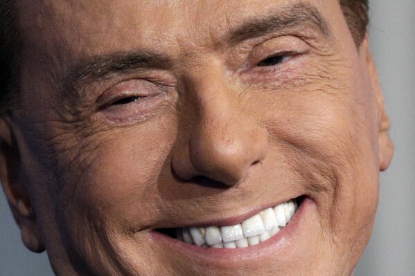 FILE - Italian former Premier and Forza Italia (Go Italy) party leader, Silvio Berlusconi, smiles during the recording of the Italian state television RAI, Porta a Porta (Door To Door) TV talk show in Rome, Jan. 11, 2018. Silvio Berlusconi, the boastful billionaire media mogul who was Italy's longest-serving premier despite scandals over his sex-fueled parties and allegations of corruption, died, according to Italian media. He was 86. (AP Photo/Andrew Medichini, File)