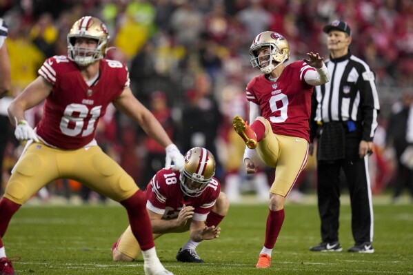 FILE - San Francisco 49ers place-kicker Robbie Gould (9), with Mitch Wishnowsky (18) holding and Tyler Kroft (81) blocking, kicks a field goal during the second half of an NFL wild card playoff football game against the Seattle Seahawks in Santa Clara, Calif., Saturday, Jan. 14, 2023. Gould, a Longtime NFL kicker, is retiring following an 18-year career that established himself as one of the game's best clutch kickers. (AP Photo/Godofredo A. Vásquez, File)