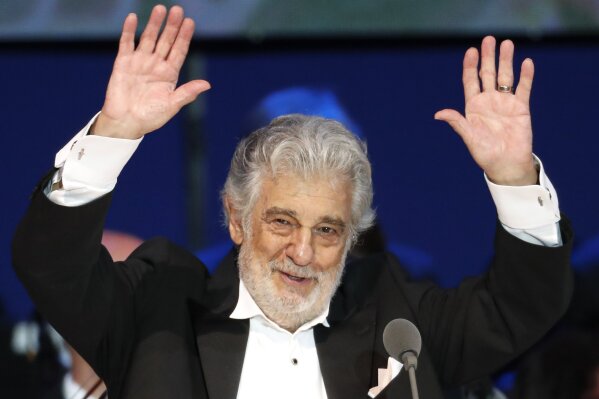 FILE - In this Aug. 28, 2019, file photo, Opera star Placido Domingo performs during a concert in Szeged, Hungary. The 78-year-old singer who rose to stardom as a tenor has been confirmed to sing the baritone title role in “Nabucco” at the Zurich Opera House this Sunday. It will be his first time performing since stepping down Oct. 2 as general director of the Los Angeles Opera and withdrawing from future performances at the company.(AP Photo/Laszlo Balogh, File)