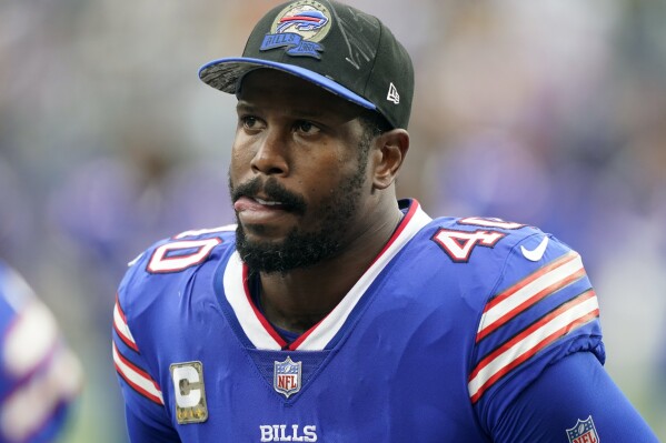 FILE - Buffalo Bills linebacker Von Miller reacts during the first half of an NFL football game against the New York Jets, Sunday, Nov. 6, 2022, in East Rutherford, N.J. Miller has turned himself in to police in a Dallas suburb after he was charged in a warrant with domestic violence against the mother of his children, who is pregnant. (AP Photo/John Minchillo, File)