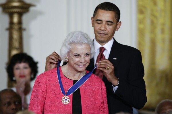 FILE - President Barack Obama presents the 2009 Presidential Medal of Freedom to Sandra Day O'Connor, Aug. 12, 2009. O'Connor, who joined the Supreme Court in 1981 as the nation's first female justice, has died at age 93. (AP Photo/J. Scott Applewhite, File)