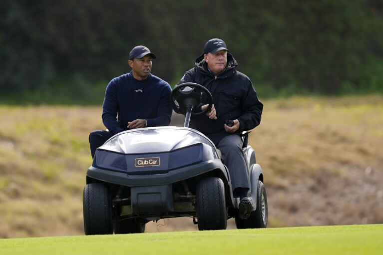 Tiger Woods is driven off the course after withdrawing during the second round of the Genesis Invitational golf tournament at Riviera Country Club Friday, Feb. 16, 2024, in the Pacific Palisades area of Los Angeles. (AP Photo/Ryan Sun)