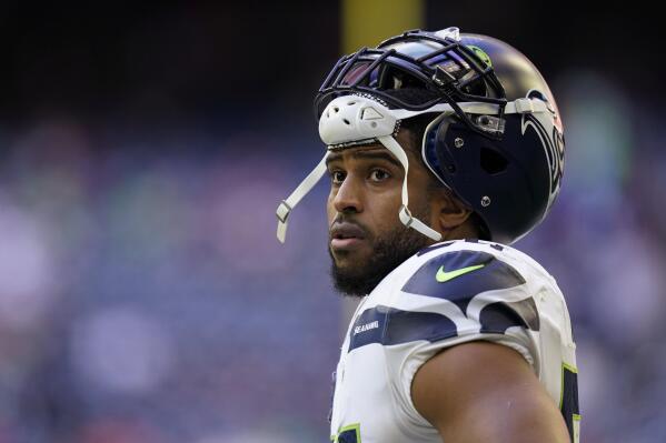 FILE - Seattle Seahawks linebacker Bobby Wagner pauses during the team's NFL football game against the Houston Texans on Dec. 12, 2021, in Houston. Wagner has been informed he is being released by Seattle. Wagner confirmed the news to The Associated Press on Tuesday night, March 8, 2022, hours after the team agreed to trade quarterback Russell Wilson to Denver. Seattle is expected to make Wagner's release official Wednesday. (AP Photo/Matt Patterson, File)