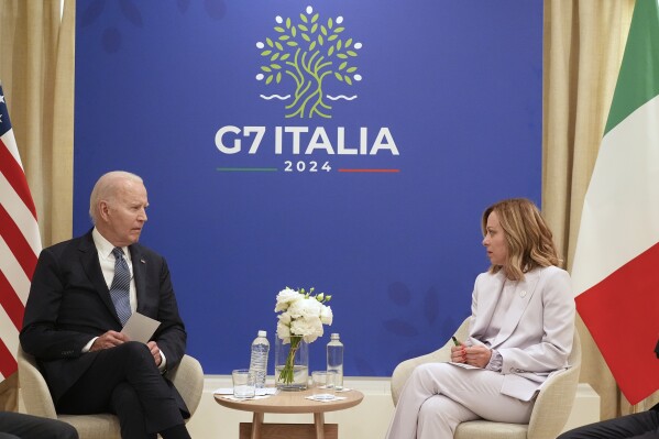 U.S. President Joe Biden and Italian Prime Minister Giorgia Meloni, right, meet for bilateral talks at the G7, Friday, June 14, 2024, in Borgo Egnazia, near Bari, southern Italy. (AP Photo/Alex Brandon)