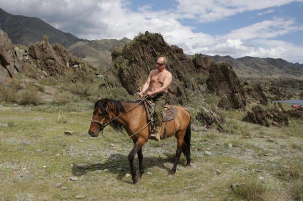 Then-Russian Prime Minister Vladimir Putin is seen riding a horse in the mountains of the Siberian region of Tuva, during his vacation on Monday, Aug. 3, 2009, . Putin sent Russian forces into Ukraine on Feb. 24, 2022, and appears determined to prevail -- ruthlessly and at all costs. (Alexei Druzhinin, Sputnik, Kremlin Pool Photo via AP)