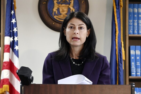 FILE - Michigan Attorney General Dana Nessel speaks during a news conference, Oct. 14, 2021, in Detroit. On Tuesday, Sept. 26, 2023, the attorney for a second defendant accused in a fake elector scheme in Michigan filed a motion for criminal charges to be thrown out after the state attorney general said that the group of 16 Republicans “genuinely” believed former President Donald Trump won the 2020 election. (Max Ortiz/Detroit News via AP, File)