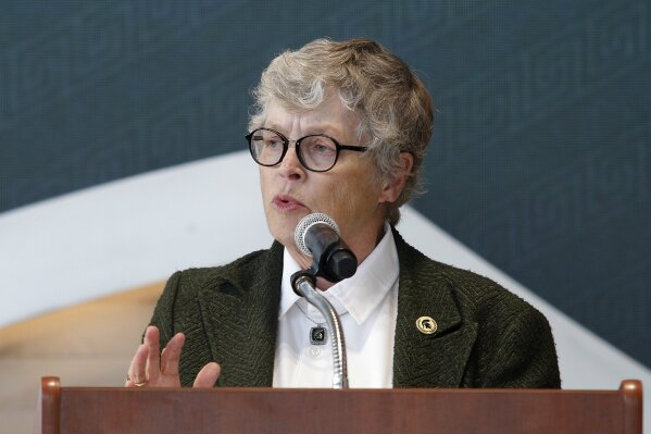 
              In this Oct. 20, 2017, photo, Michigan State University President Lou Anna Simon speaks during the dedication ceremony for the Gilbert Pavilion and Tom Izzo Hall of History inside Michigan State's Breslin Student Events Center in East Lansing, Mich. Simon submitted her resignation Wednesday, Jan. 24, 2018, amid an outcry over the school's handling of allegations against Larry Nassar. (AP Photo/Al Goldis, File)
            