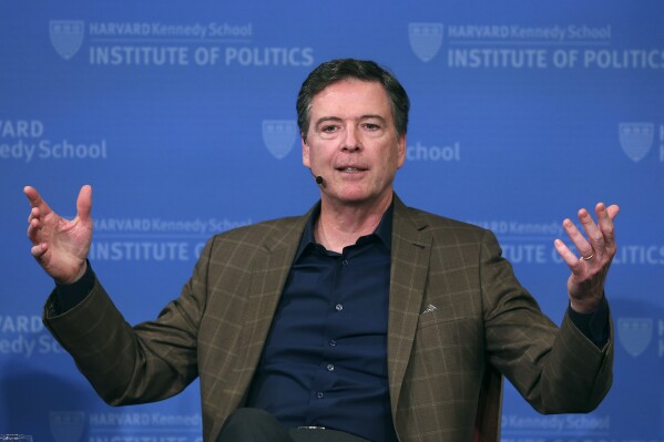 Former FBI director James Comey gestures while speaking at Harvard University's Institute of Politics' JFK Jr. Forum in Cambridge, Mass., Feb. 24, 2020. (AP Photo/Charles Krupa, File)