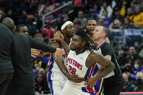 Detroit Pistons center Isaiah Stewart (28) is held back after a foul during the second half of an NBA basketball game against the Los Angeles Lakers, Sunday, Nov. 21, 2021, in Detroit. (AP Photo/Carlos Osorio)