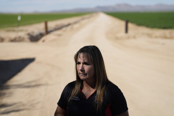 La Paz County Supervisor Holly Irwin speaks with The Associated Press, Tuesday, Oct. 17, 2023, in Wenden, Ariz. Irwin welcomes a recent crackdown by Arizona officials on unfettered groundwater pumping long allowed in rural areas, noting local concerns about dried up wells and subsidence that's created ground fissures and flooding during heavy rains. (AP Photo/John Locher)