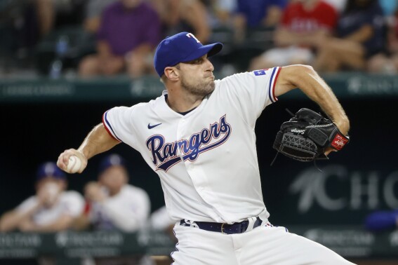 Texas Rangers starting pitcher Max Scherzer throws against the Chicago White Sox during the first inning of a baseball game, Thursday, Aug. 3, 2023, in Arlington, Texas. (AP Photo/Michael Ainsworth)