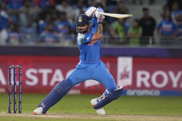 India's Virat Kohli plays a shot during the ICC Champions Trophy cricket match between India and Pakistan at Dubai International Cricket Stadium, United Arab Emirates, Sunday, Feb. 23, 2025. (AP Photo/Altaf Qadri)