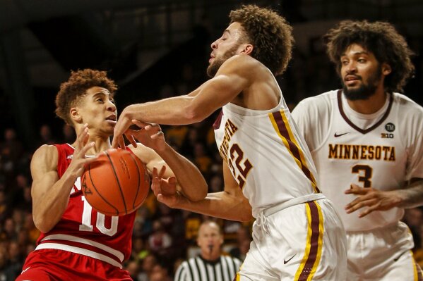 
              Minnesota's Gabe Kalscheur (22) strips the ball away from Indiana's Rob Phinisee (10) as Jordan Murphy (3) watches in the second half of an NCAA college basketball game Saturday, Feb. 16, 2019, in Minneapolis. Minnesota won 84-63. (AP Photo/Bruce Kluckhohn)
            