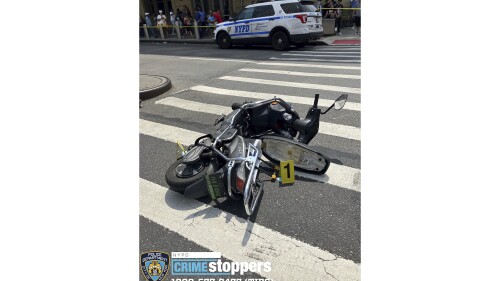 This photo provided by the New York City Police Department, Saturday, July 8, 2023, shows a motor scooter recovered at the scene of a shooting, in the Queens borough of New York. An 86-year-old New York City man was fatally shot and at least two others were seriously wounded by a man on a scooter who police say was shooting randomly at cars and pedestrians in Queens on Saturday. (New York City Police Department via AP)