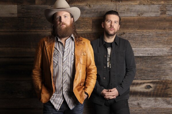 
              FILE - In this Jan. 9, 2018, file photo, John, left, and T. J. Osborne, of the group Brothers Osborne, pose in Nashville, Tenn. The duo were nominated for three  CMT Music Awards on Tuesday, May 7, 2019. (AP Photo/Mark Humphrey, File)
            