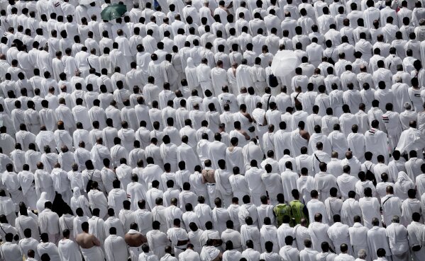 FILE - In this Sept. 11, 2016 file photo, Muslim pilgrims pray outside Namira Mosque in Arafat, on the second and most significant day of the annual hajj pilgrimage, near the holy city of Mecca, Saudi Arabia. After spending the night in the massive valley of Mina, the pilgrims head to Mount Arafat, some 20 kilometers (12 miles) east of Mecca, for the pinnacle of the pilgrimage. (AP Photo/Nariman El-Mofty, File)